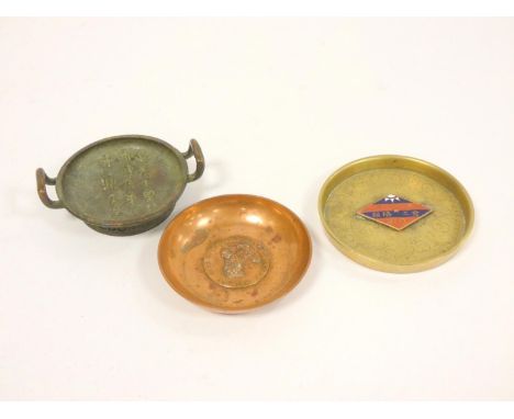 Copper trinket dish inscribed Pekin Palace Dog Association, a twin handled bronze dish, and a brass trinket dish with Labour 
