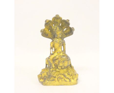 Tibetan gilt bronze Guanyin Naga figure with five cobra aureole, bearing six character inscription marks to back. Height 27cm