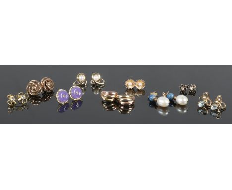 A pair of 14ct Gold lilac jade and eight pairs of 9ct Gold ear studs. Total weight: 13.95g  One earring back missing from bla