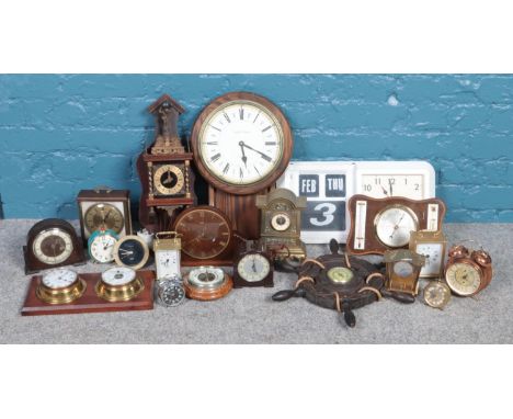 A large quantity of clocks and barometers. To include Acctim 'Flip' wall clock, H. Samuel alarm clock and Metamec examples.  