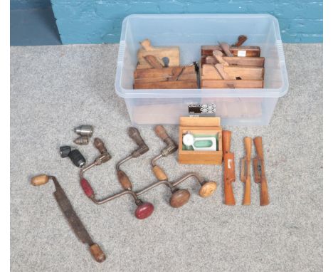 A box of assorted woodworking tools. To include eight wood moulding planes, three hand drills and a boxed Mercer Dial thickne
