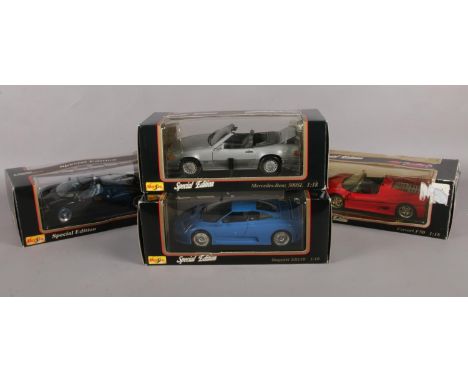 A quantity of die cast vehicles. (4) 1.18 scale Maisto special edition model cars. Ford GT90, Bugatti EB110, Ferrari F50 &amp