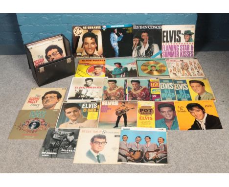 A carry case with vinyl records. To include a large collection of Elvis Presley, Buddy Holly and The Platters etc.  