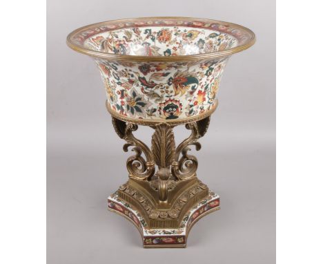 A large brass and ceramic centerpiece, produced by Wong Lee. Ceramic bowl surrounded by brass rim, raised on triangular stand