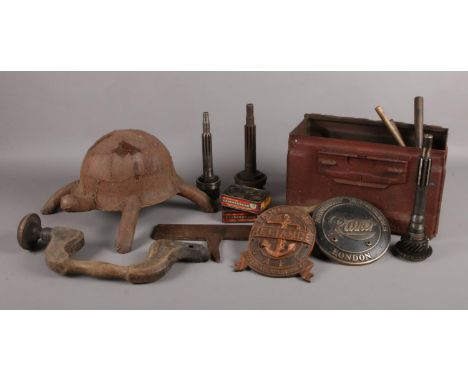 A selection of assorted metalwares. To include a metal box of car pistons, a WW1 Japanese helmet tortoise, hand drill and two