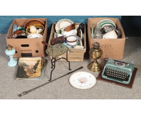 Three boxes of miscellaneous. Including paperweights, Imperial typewriter, metalwares, brass oil lamp, ceramic planters, etc.
