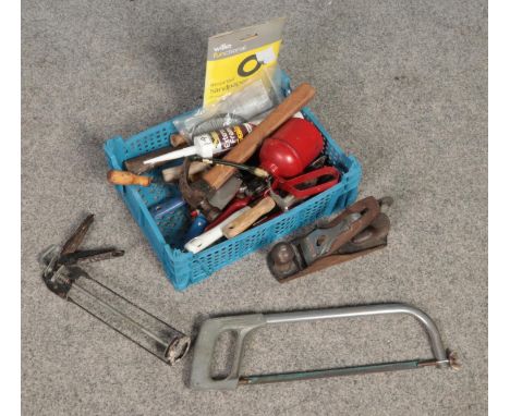 A small box of tools. Includes saw, wood plane, oil spray etc.  