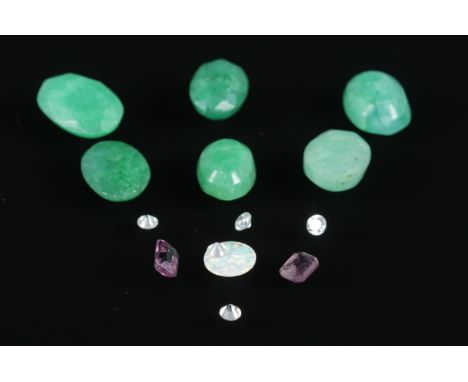 A quantity of semi-precious stones. To include opal and jade examples.  