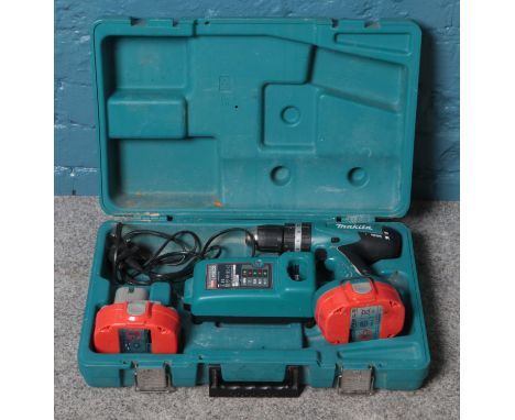 A Makita 8391D 18V rechargeable drill, with spare battery, charger and protective carry case.  