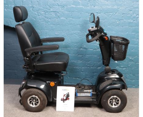 A CareCo Daytona mobility scooter, with charger, owner's manual and key.  