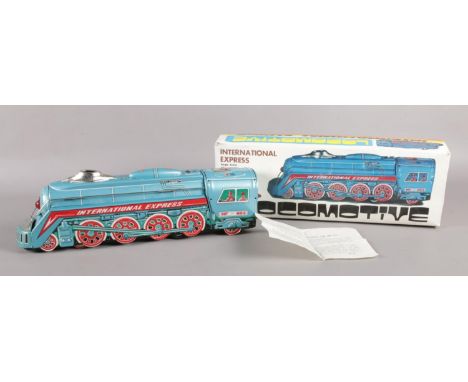 An International Express large scale 'Friction' locomotive. Boxed, made in China. H:11cm W: 39.5cm.  