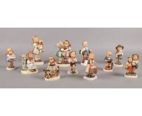 A collection of Hummel figures. (11) 'Sweet as can be', 'School Boy', 'Surprise', 'Kiss Me' 'Just Resting' etc  