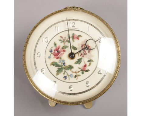A Regent of London alarm clock. Tapestry inlay. 15cm height.  working