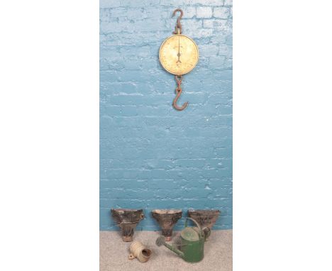 An assortment of metalwares. To include Salter butcher's scales, drain hoppers and a watering can.  