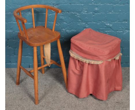 A child's highchair along with a sewing/work box with contents of tools.  