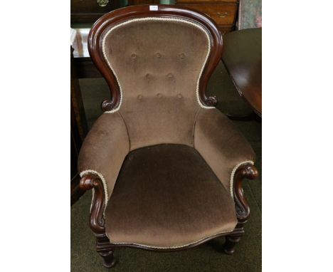 A Victorian mahogany framed button back armchair