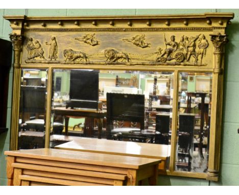 A Regency inverted breakfront gilt framed sectional mirror, the three bevelled plates flanked by Corinthian columns 