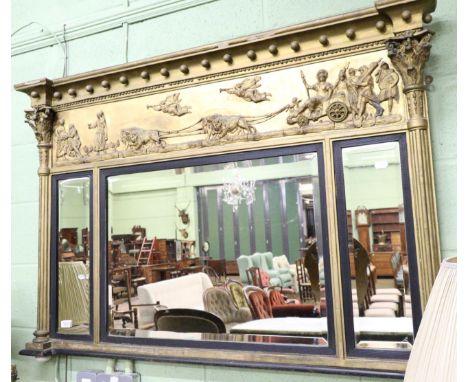 A Regency gilt framed, inverted breakfront sectional mirror with ebonised slips and bevelled plates
