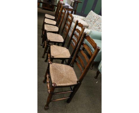 A composite set of six rush seated ladder back dining chairs 