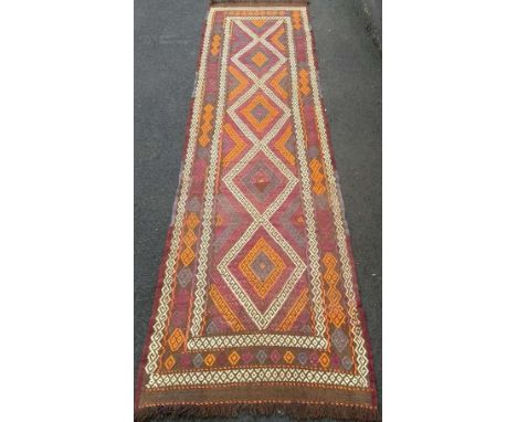 A Suzani hand-knotted Kilim wool runner with multicoloured decoration, 285 x 80 cm in good condition, light wear