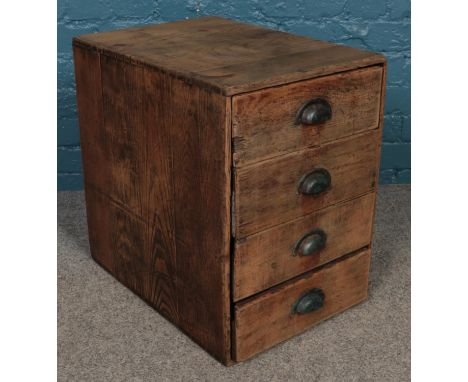 A vintage oak bank of drawers. With cup handles (53cm x 38cm x 53cm)  Missing back panel.
