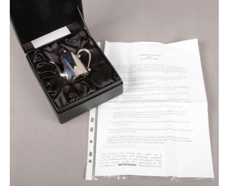 A cased sterling silver miniature Georgian style coffee pot. Bearing the millennium hallmark, and presentation letter from Wi