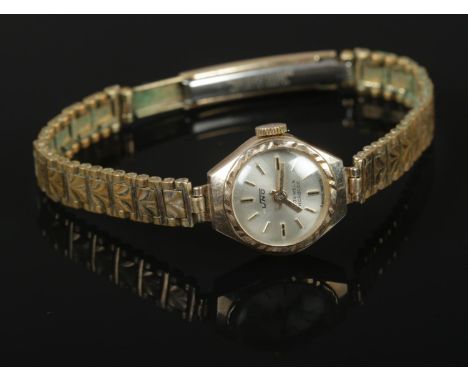 A ladies 9ct gold Uno manual wind wristwatch, with expanding stainless steel strap and 17 jewel Incabloc movement.  Running.