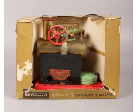 A Mamod Minor 1 steam engine in original box.  The box is damaged and ripped.