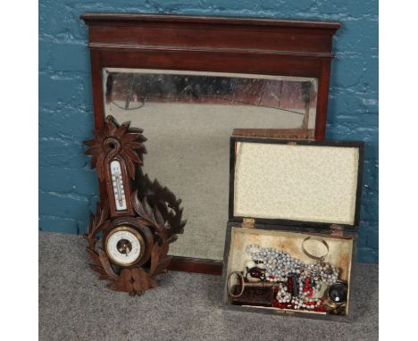 A mahogany framed mirror along with a carved barometer and a walnut box with contents of costume jewellery.  