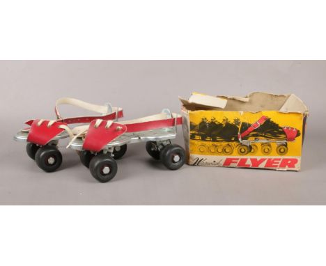 A pair of Warwick Flyer roller skates in original box.  Box is missing top.