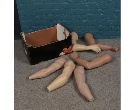 A box of of five mannequin arms with detachable hands.  Some arms don't have hands and are slightly damaged.