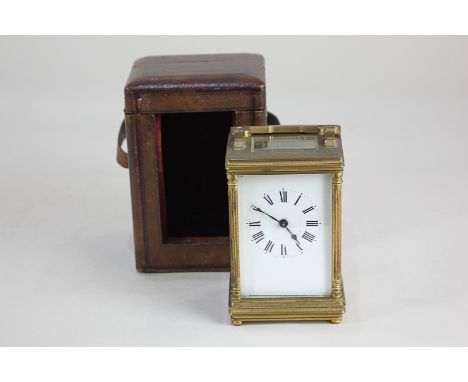 A glass and bevelled glass carriage clock, the movement stamped France, white enamel dial with Roman numerals, 15.5cm (a/f), 