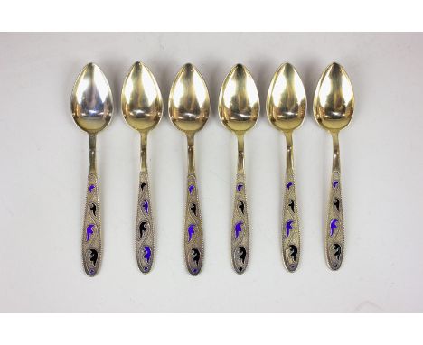 A set of six Russian silver gilt and enamel coffee spoons with foliate decorated handles, with hammer and sickle mark and num