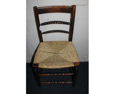 A 19th century oak rush seat chair with bobbin turned supports