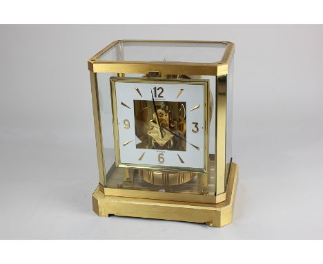 A Jaeger LeCoultre Atmos mantel clock, 12cm square dial in gilt metal framed glazed case, 23cm high