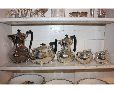 A Mappin &amp; Webb four piece silver plated tea set of teapot, hot water jug, sugar bowl and cream jug, oval form on ball fe