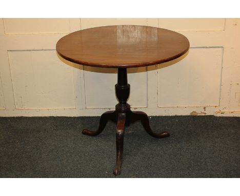 A 19th century circular mahogany tilt-top table on baluster turned stem and outswept tripod legs, 75.5cm