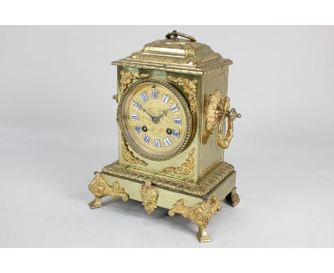 A French gilt metal mantel clock, circular dial with blue and white enamel cartouche numerals, movement stamped H Molle, Pari