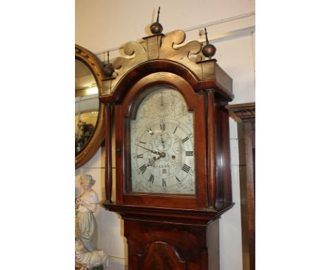 A George III flame mahogany longcase clock, maker James Smith Lynn, the domed 12 inch silverised dial with secondary dial and