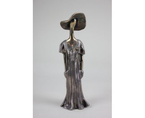 Ruth Bloch (born 1951, Israel), a silver plated sculpture of a woman wearing a sunhat and dress, stamped 'R.B 925' verso, 22c