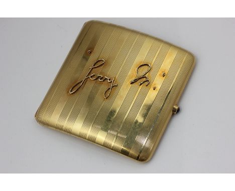 Horse racing Interest, an 18ct gold cigarette case, engine turned, with cabochon thumb piece applied with the name Jerry M. a