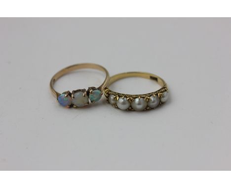 An opal three stone ring, a four bead pearl ring