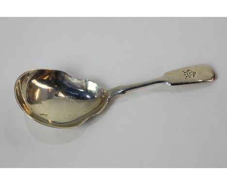 A Victorian silver caddy spoon with pear shaped bowl, fiddle pattern handle with engraved initials, maker James Whipple &amp;