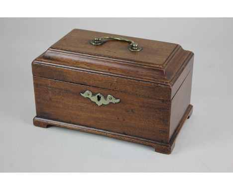 A George III mahogany tea caddy with cushion top and central brass handle, interior with later alterations, 23cm