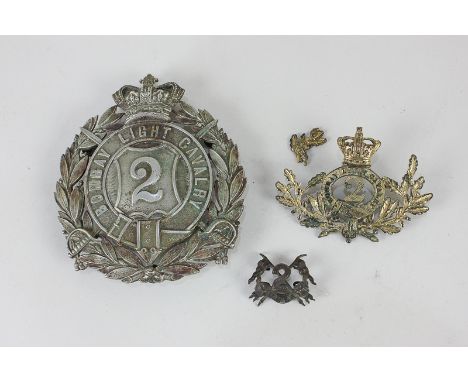A collection of Victorian Officers badges from the Indian army, 2nd Bombay Light Cavalry, the largest with silvered finish an