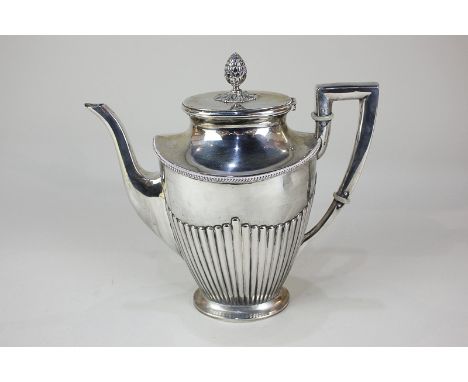 A German 800 silver coffee pot of half reeded form with cone finial, makers Koch &amp; Bergfield, Bremen, presented on base, 