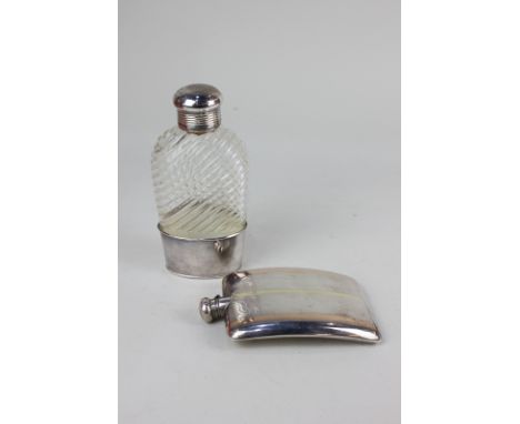 A sterling silver hip flask, curved shape with banded gilt decoration, bayonet lid marked sterling, 13cm, and a glass flask w