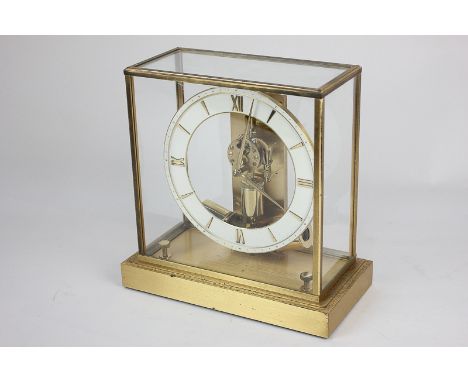 A Junghans Ato mantel clock in square glass and brass case, 22cm