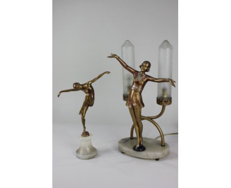 An Art Deco style figural table lamp modelled as a gold painted figure with arms outstretched, and two light holders with fro