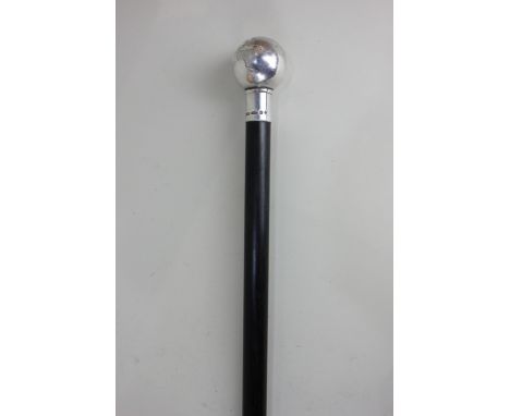 An Elizabeth II silver mounted ebony walking stick modelled as a globe, maker KC, Birmingham 2000, 91cm